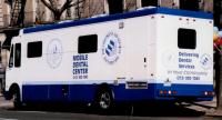 DentCare mobile Dental Service van which is white and blue in color
